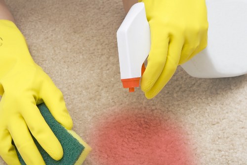 Carpet cleaning team preparing equipment safely