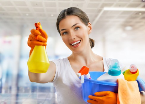 Staff member wearing PPE while operating carpet cleaning equipment
